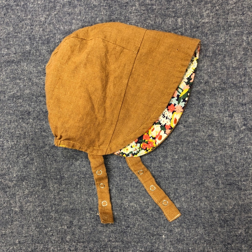 Hand-crafted reversible baby bonnet with snappy chin strap Size 12-24 months